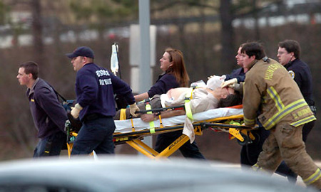 Paramedics rush a shooting victim out of the Shelby Centre at the University of Alabama's Huntsville campus Photograph: Eric Schultz/AP